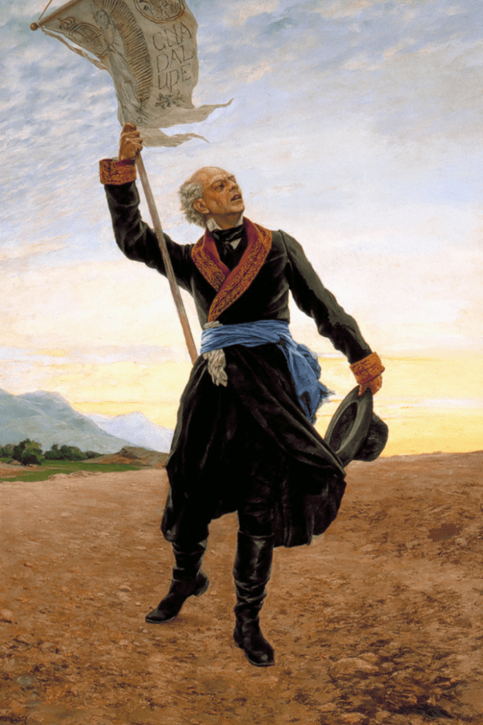 Miguel Hidalgo y Costilla, leader of Mexican Independence holding white flag that reads "Guadalupe".