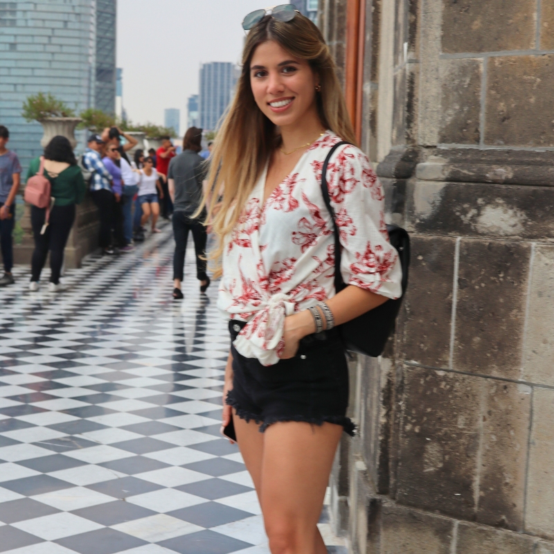 My daughter standing on the black and white checkerboard floor of Castillo Chapultepec in Mexico City.